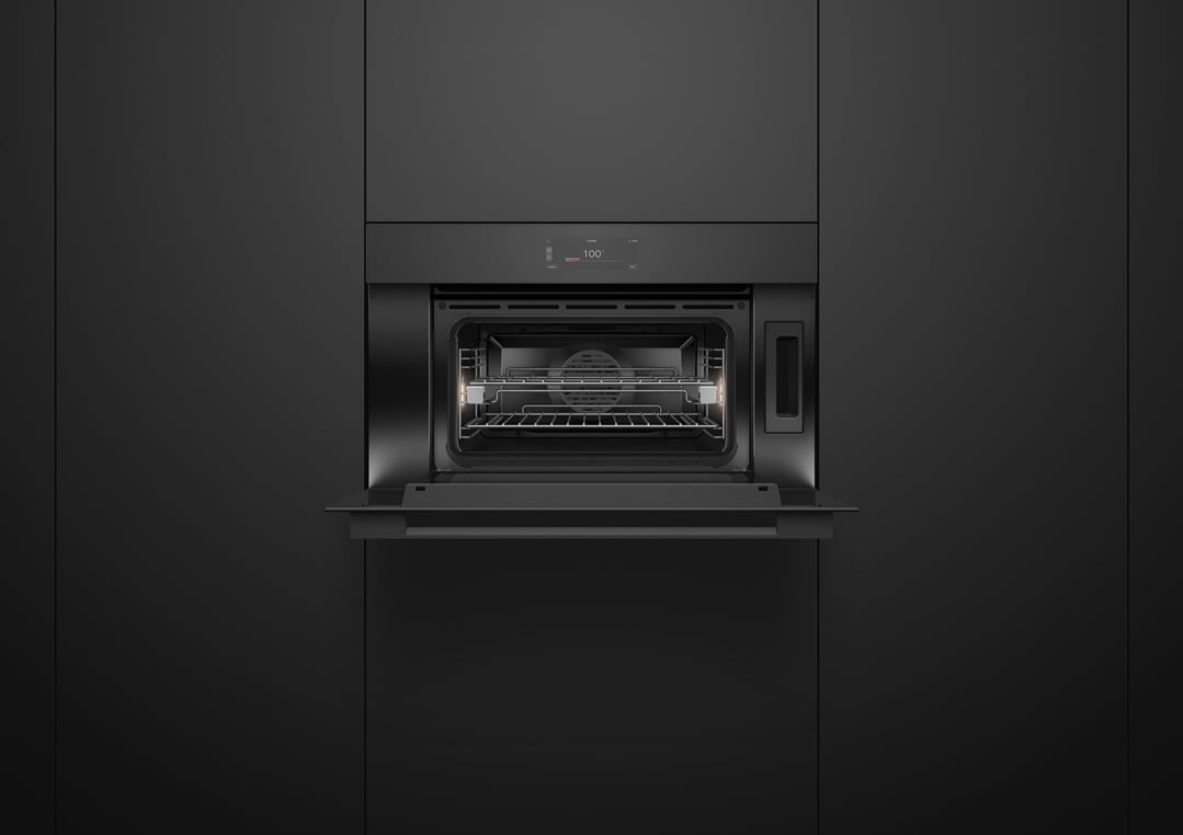 Built-in compact combi-steam oven with door open, showing interior and display