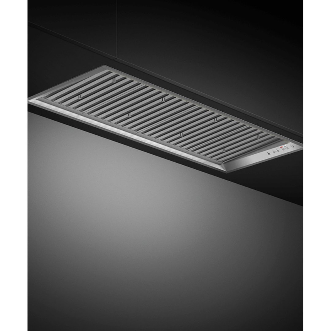 Integrated insert rangehood installed in a dark kitchen ceiling, viewed from below
