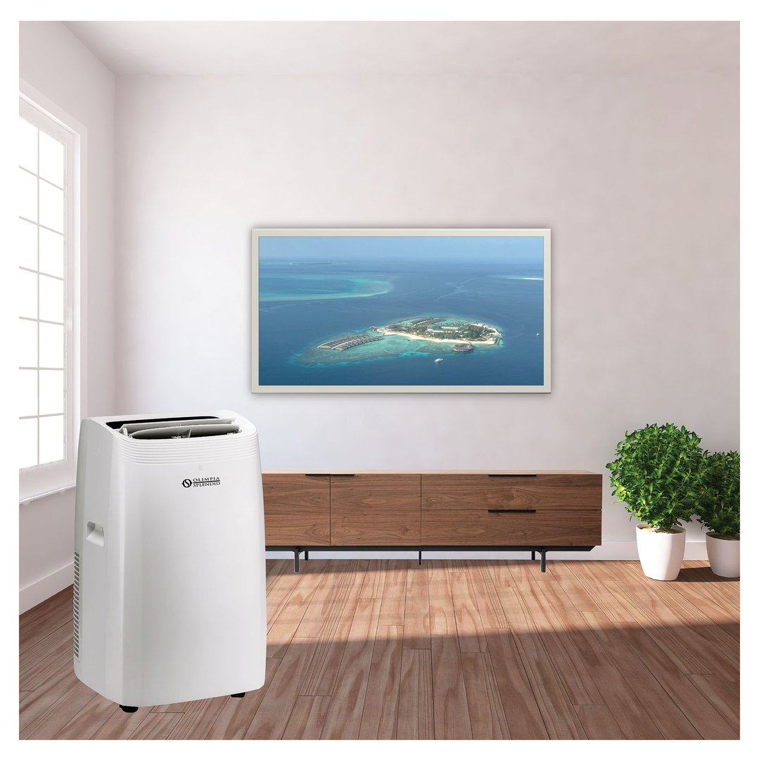 White portable air conditioner in a living room with a large TV screen
