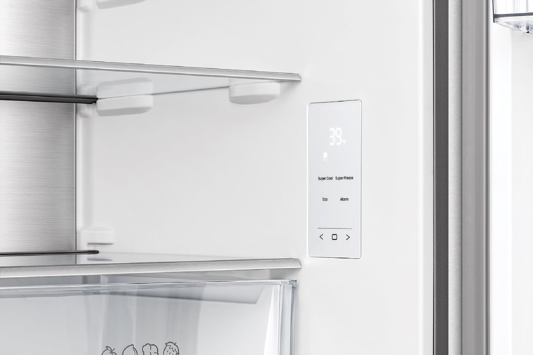 Interior view of a fridge showing shelves and temperature control panel