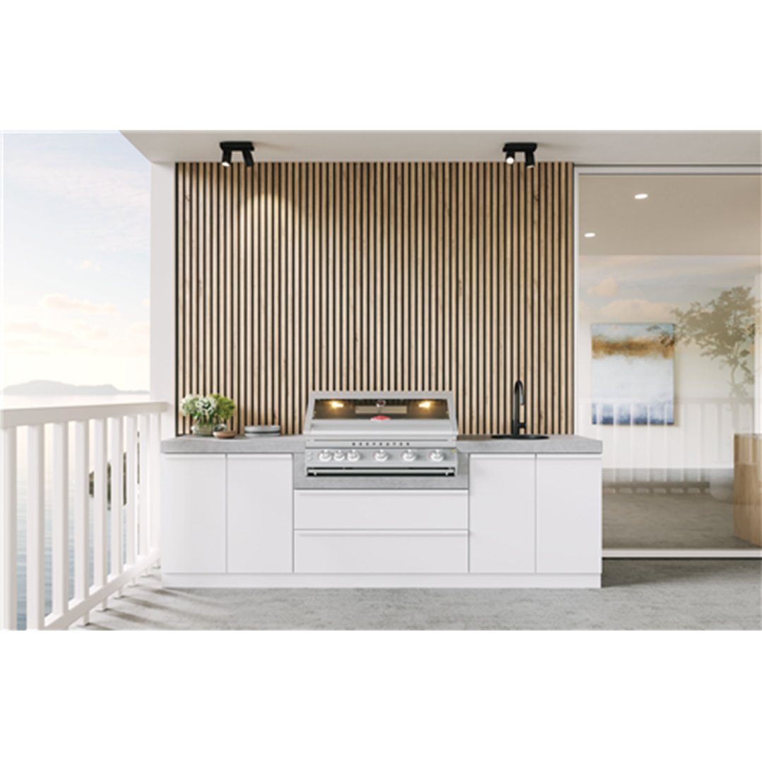 Built-in 5 burner BBQ on a balcony with a view of the ocean