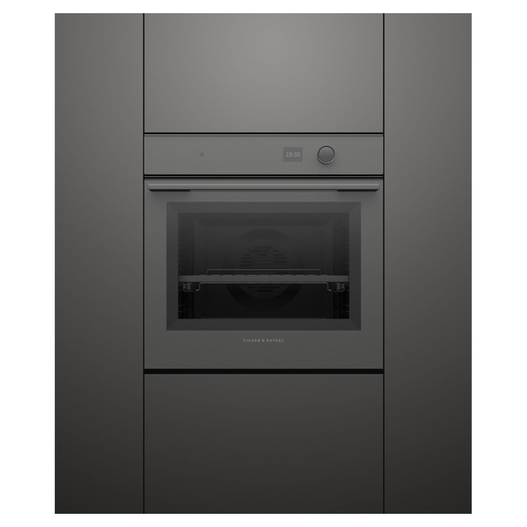Built-in dark grey oven with a digital display showing 19:30, installed in a dark grey kitchen cabinet