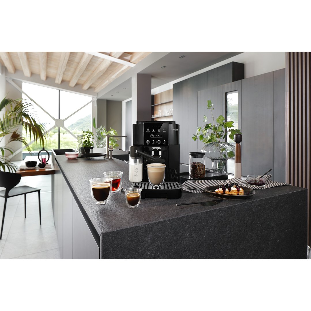 Magnifica Start coffee machine on a kitchen counter with drinks and snacks