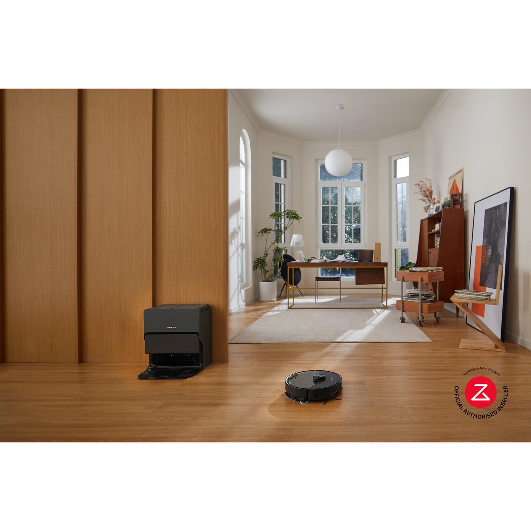 Robotic vacuum cleaner and its dock in a modern living room with wooden floors