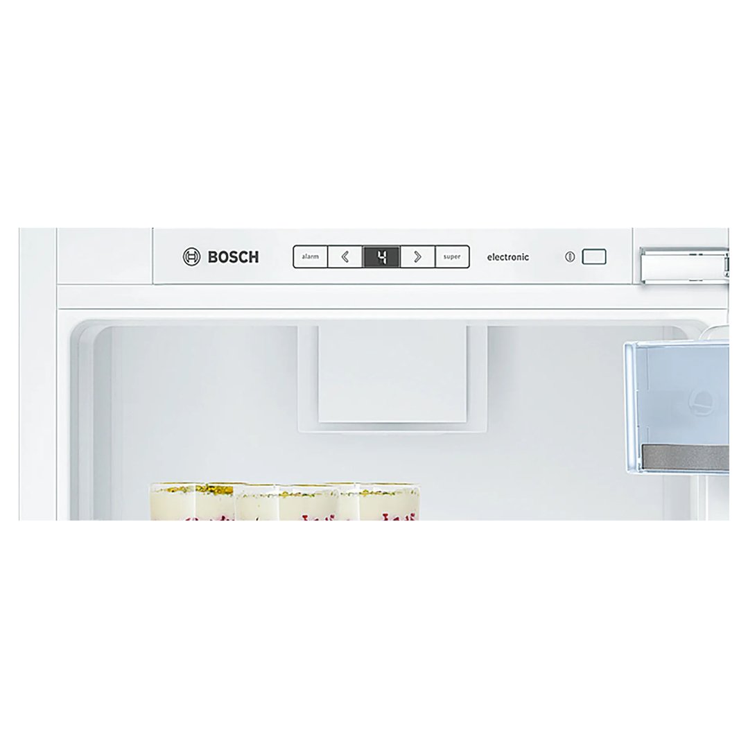 Close-up of the interior of a Bosch fridge with control panel and desserts