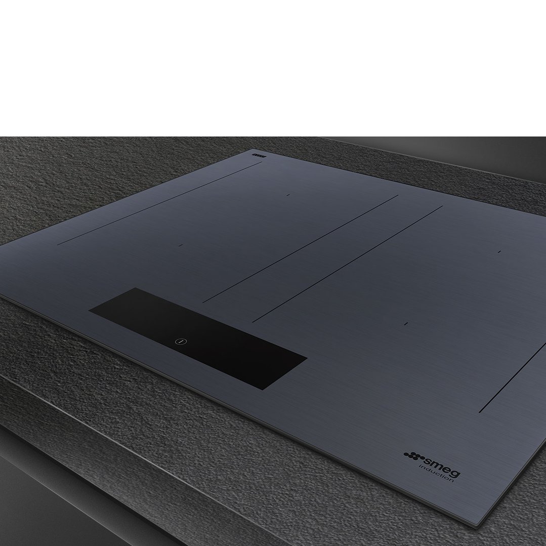 SMEG Linea induction cooktop in Neptune Grey on a dark textured countertop