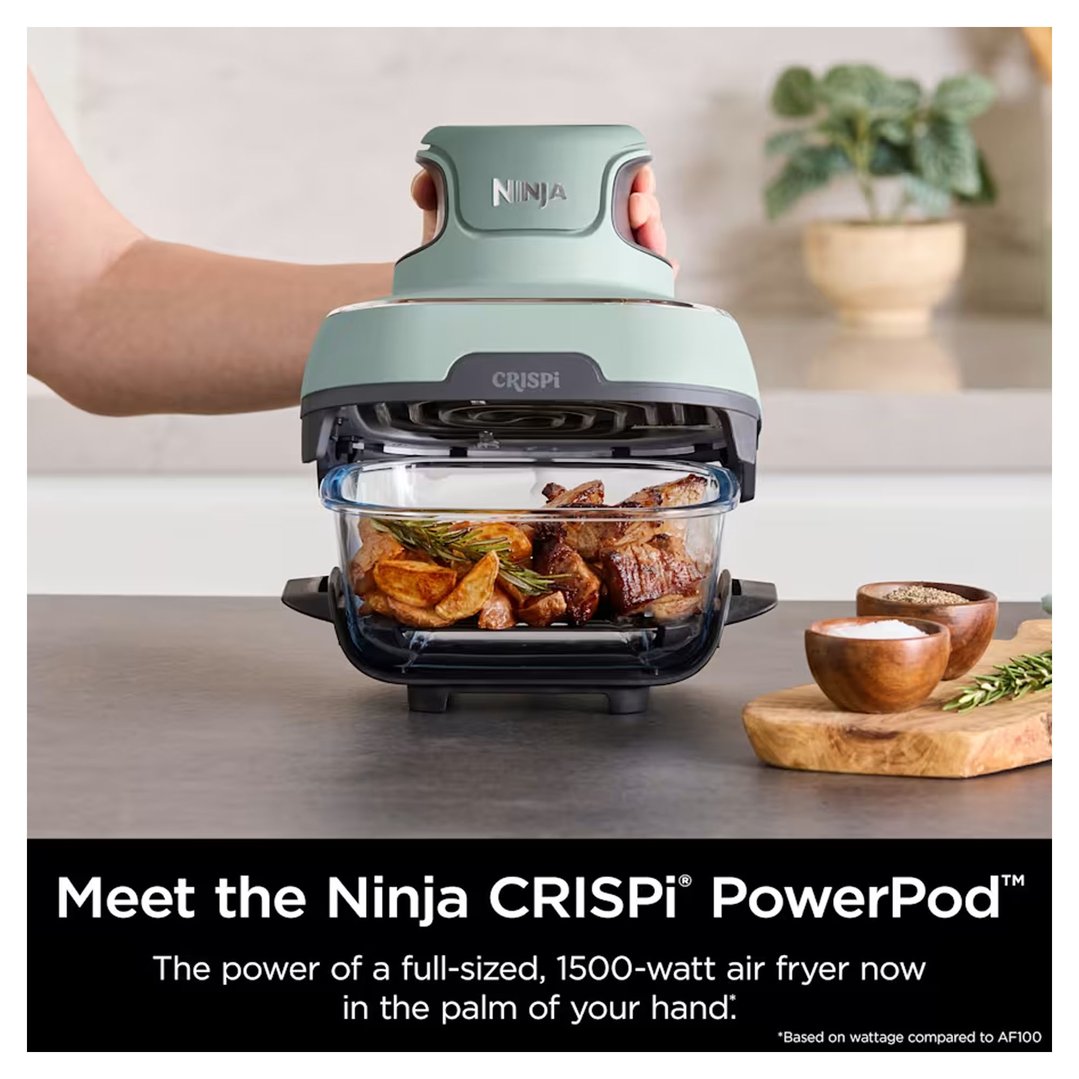 Hand placing the Ninja Crispi PowerPod air fryer lid onto a glass bowl