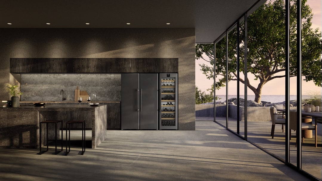 Two Liebherr wine fridges and a refrigerator in a modern kitchen with ocean view