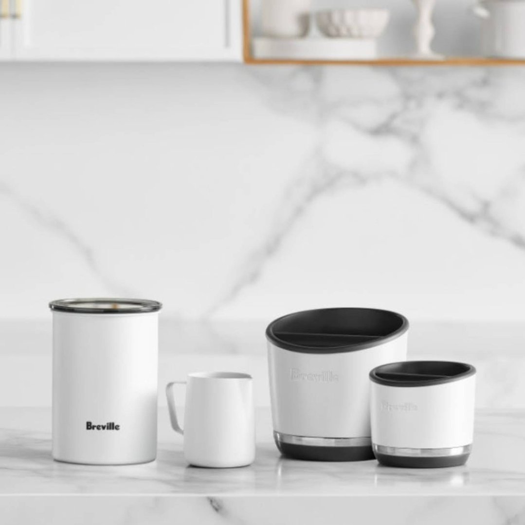 Breville Knock Box 10 Sea Salt and accessories on a marble countertop
