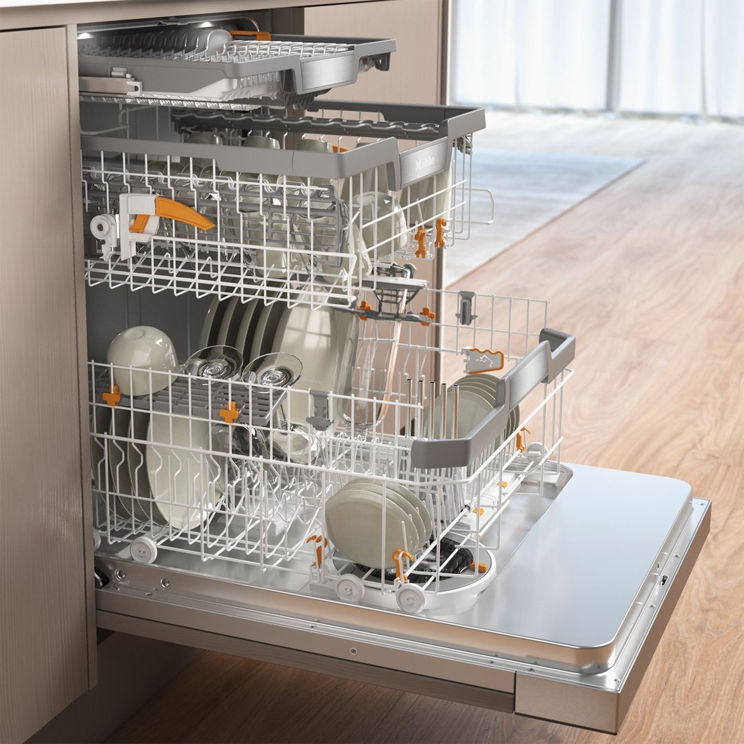 Open dishwasher with dishes inside, in a kitchen setting