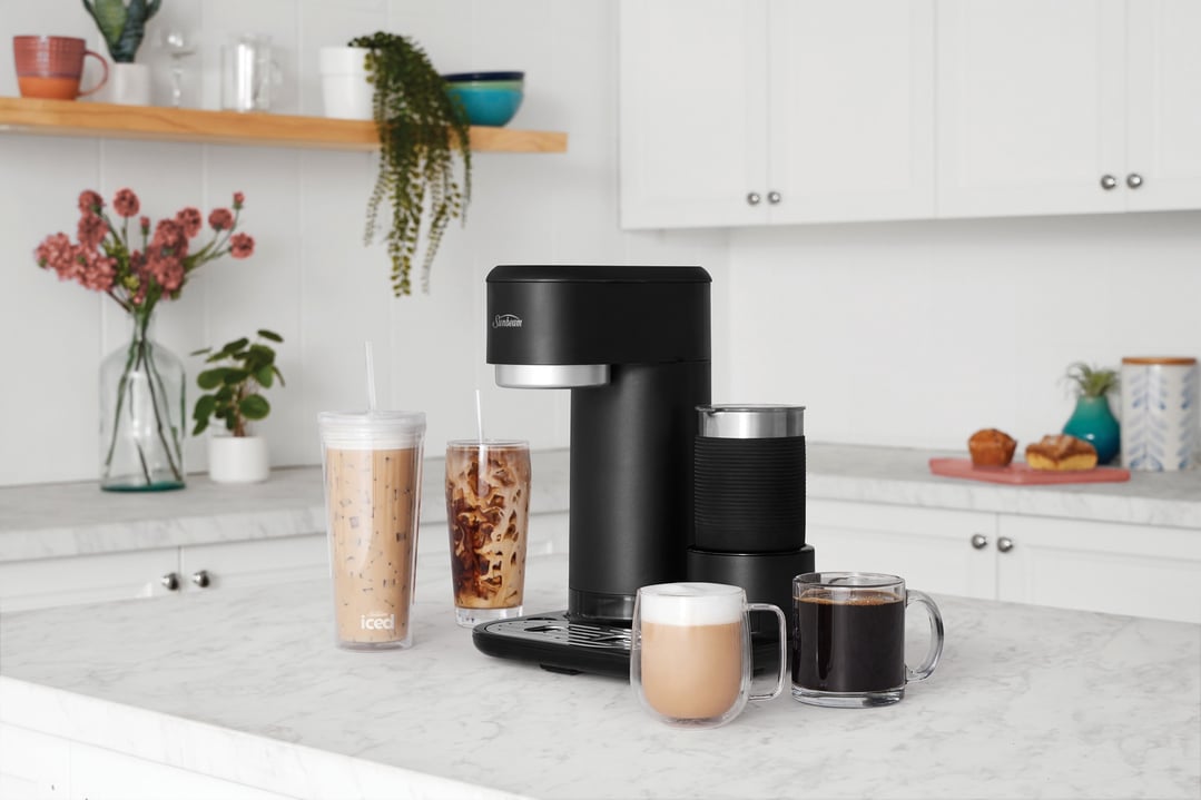 Black Iced + Hot Coffee Machine on a kitchen counter with various drinks