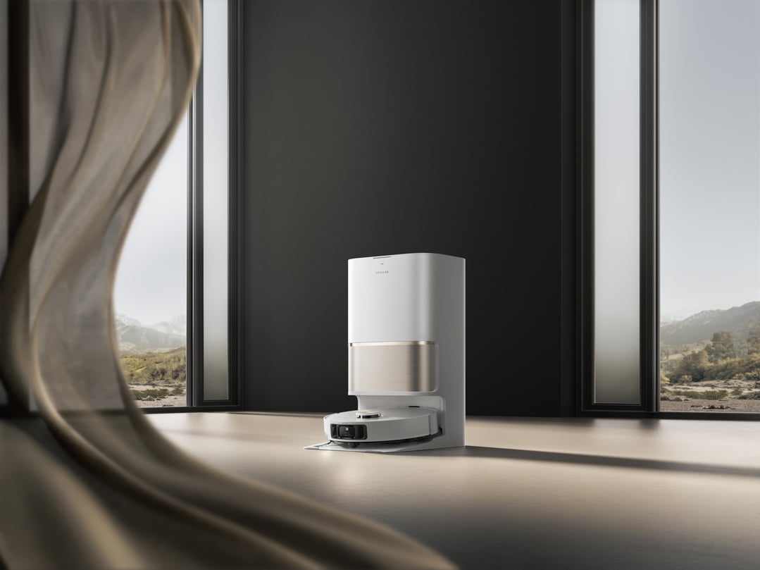 Robot vacuum and mop with auto-empty station in a modern room
