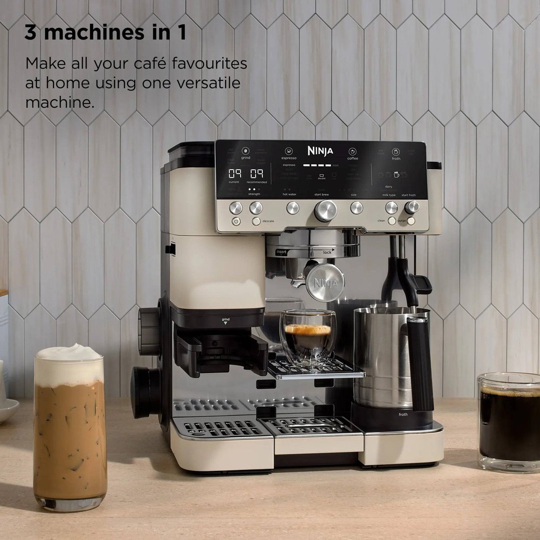 Ninja coffee machine on a counter with two coffee drinks and text overlay
