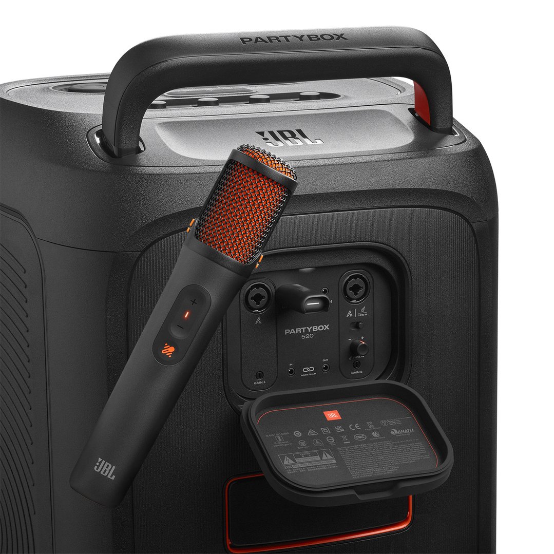 JBL microphone and Partybox speaker with open port cover, angled close-up