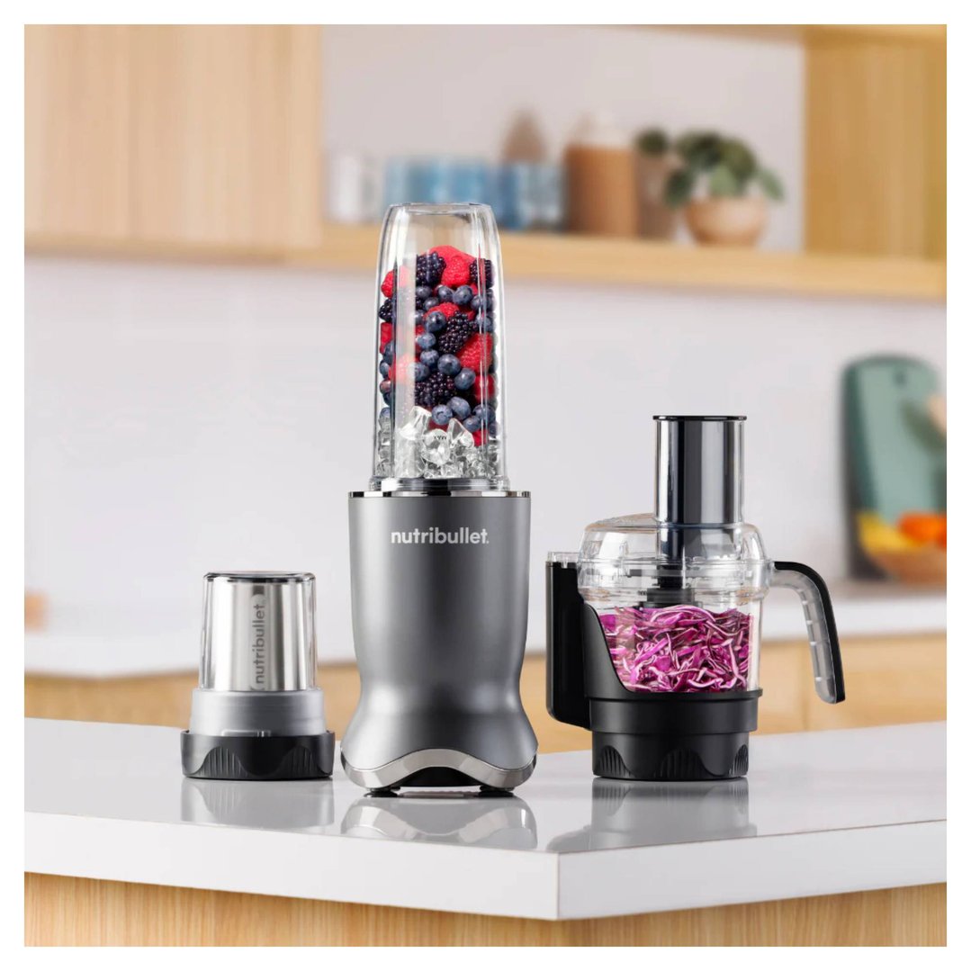 NUTRiBULLET blenders and food processor on a kitchen counter with berries and cabbage