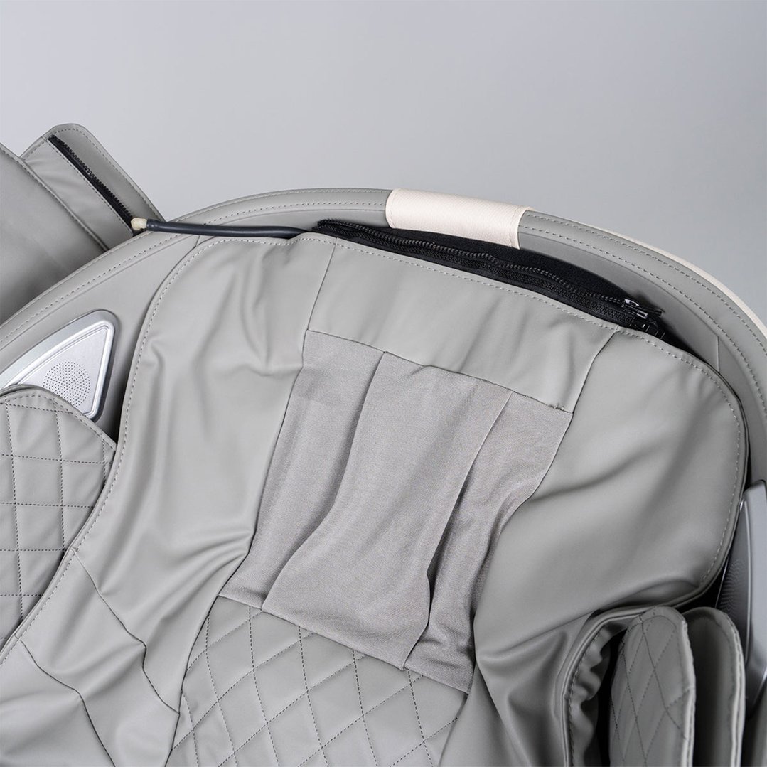 Close up of the grey upholstery and speaker on the massage chair