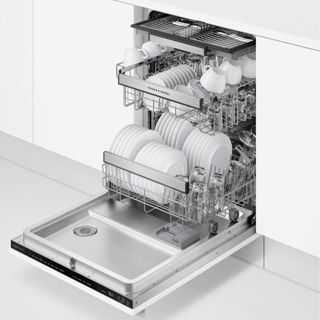 Integrated dishwasher with door open, showing dishes and cups inside