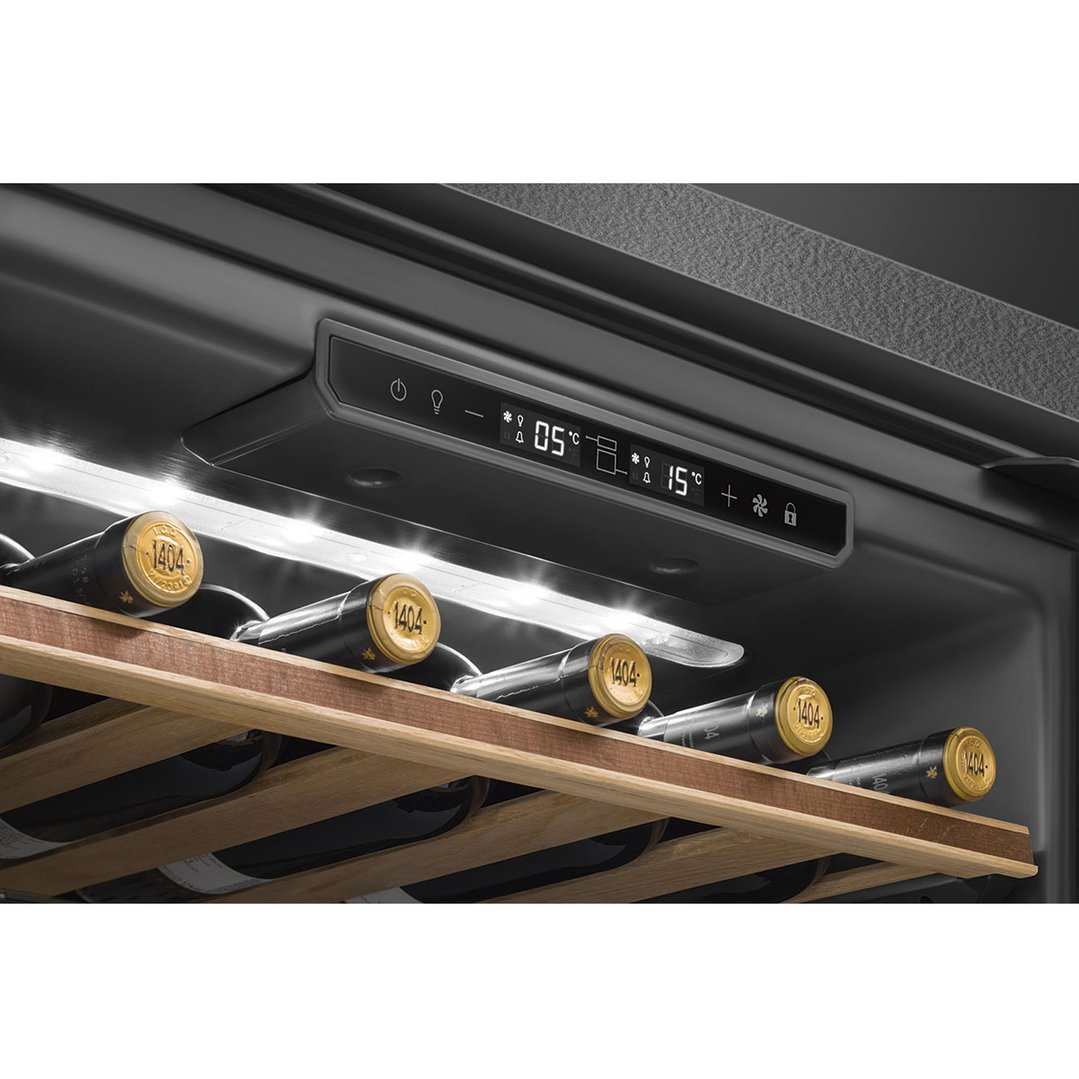Close-up of the control panel and wine bottles inside a wine cooler