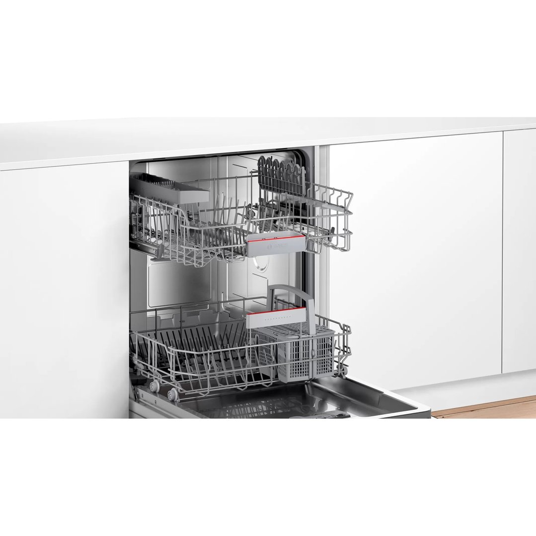 Open dishwasher with two racks visible in a modern kitchen setting