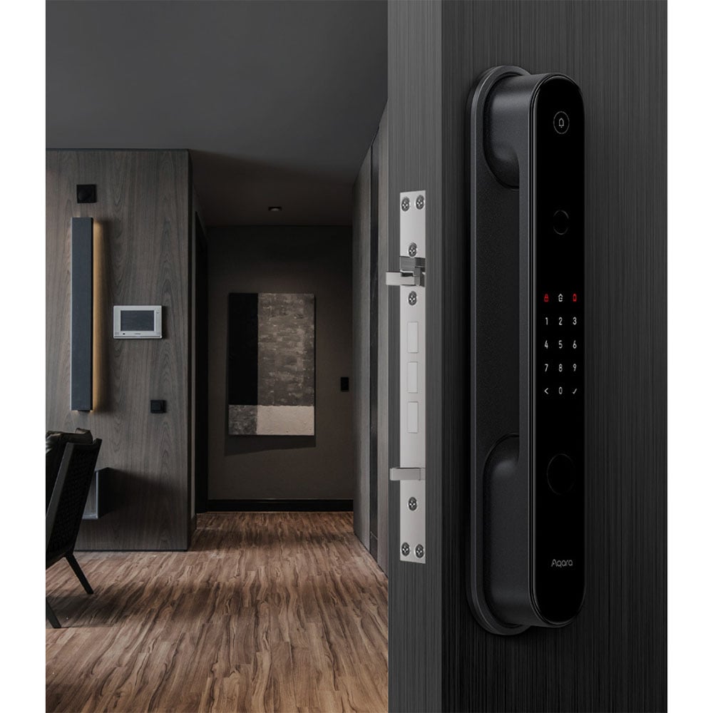 Black smart digital door lock on a dark wooden door in a modern interior