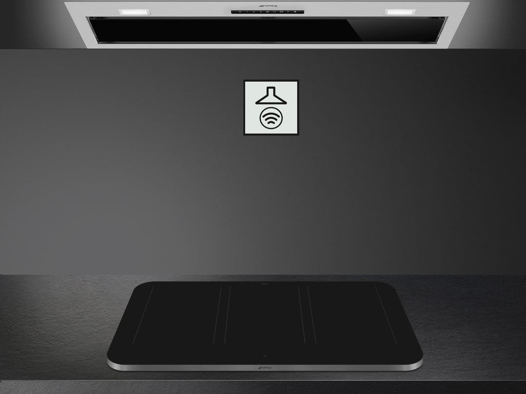 Induction cooktop and rangehood in a modern kitchen setting with a smart icon