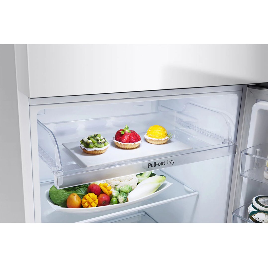 Open LG fridge showing pull-out tray with desserts and fresh produce below