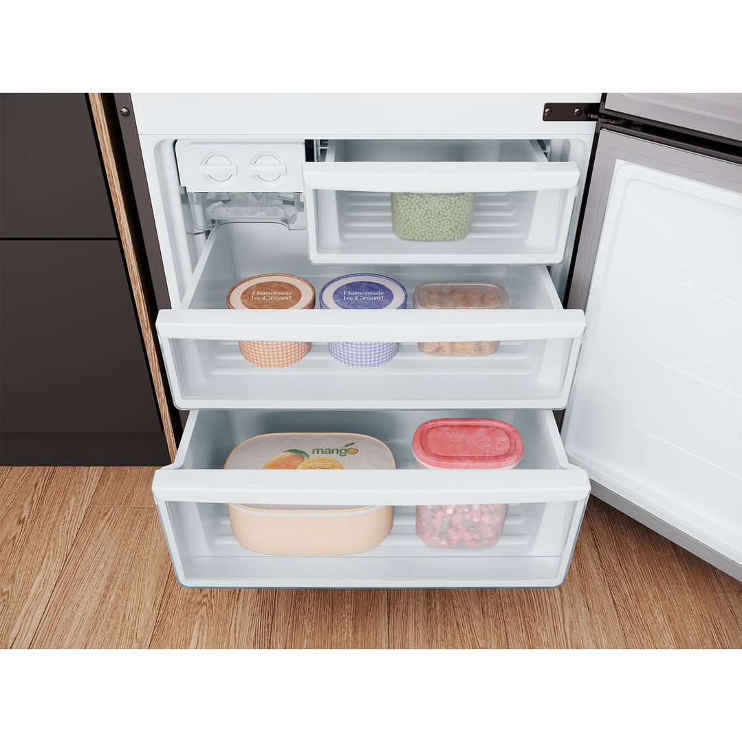Open freezer compartment of a bottom mount fridge with food items inside