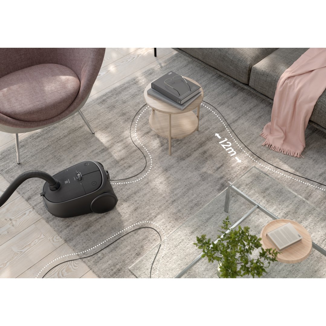 Electrolux Clean 600 Canister Bagged Vacuum Cleaner on a rug in a living room