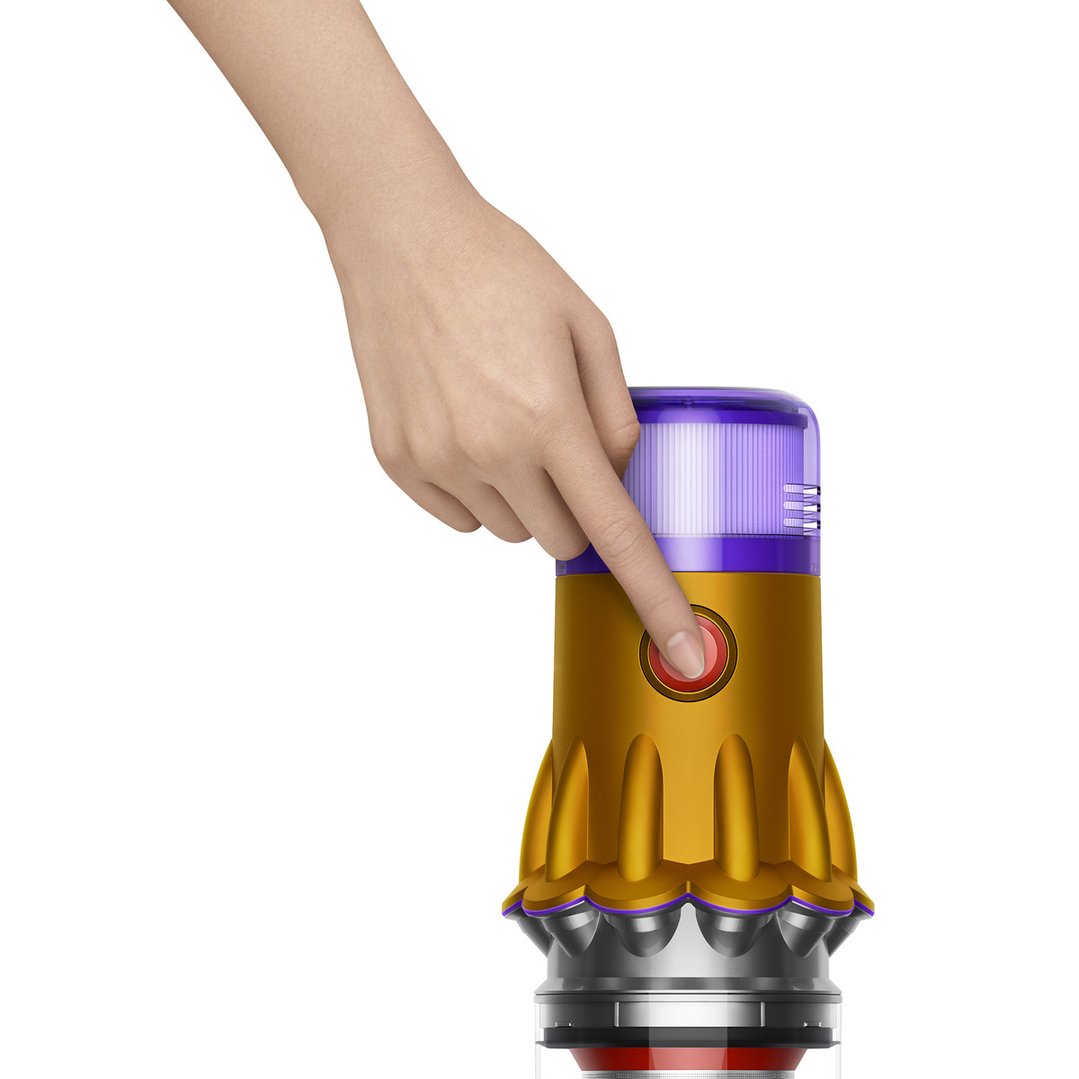 Hand pressing the red power button on a Dyson V12 Detect Slim Total Clean Stick Vacuum