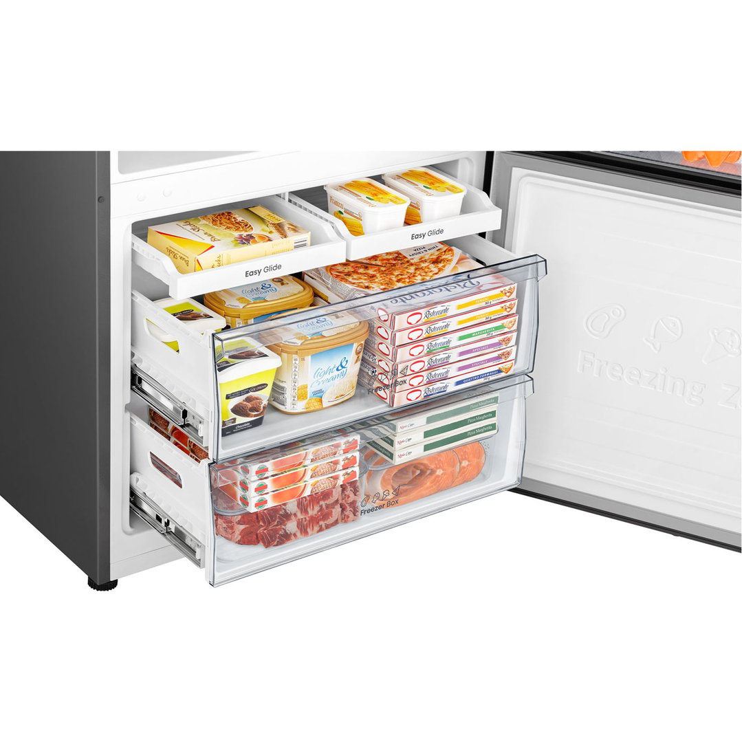Open bottom mount fridge freezer drawers filled with various frozen foods
