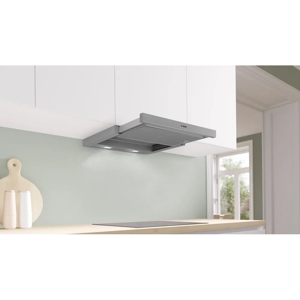 A Bosch slideout rangehood installed above an induction cooktop in a modern kitchen