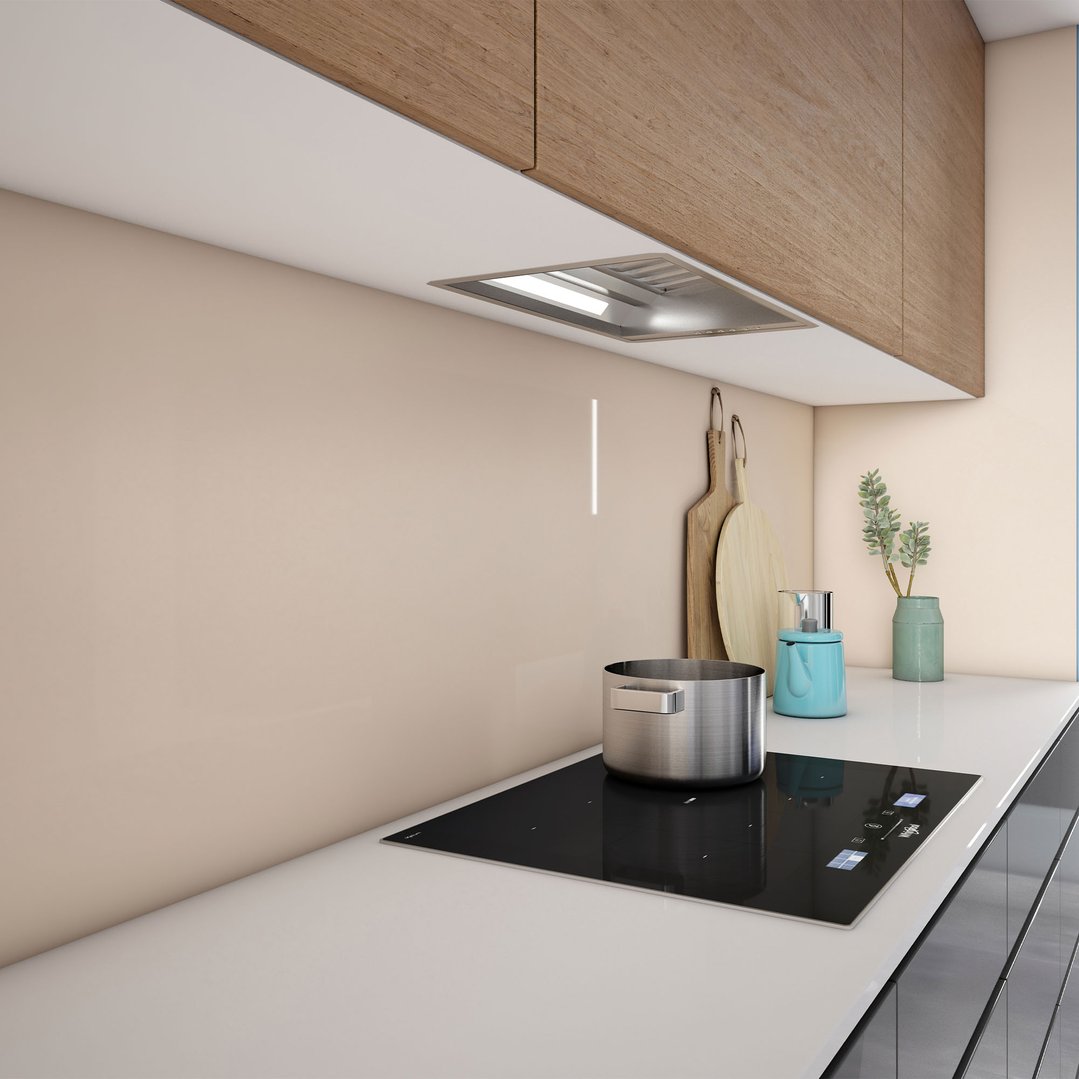 Undermount rangehood integrated into kitchen cabinetry above a cooktop with pot