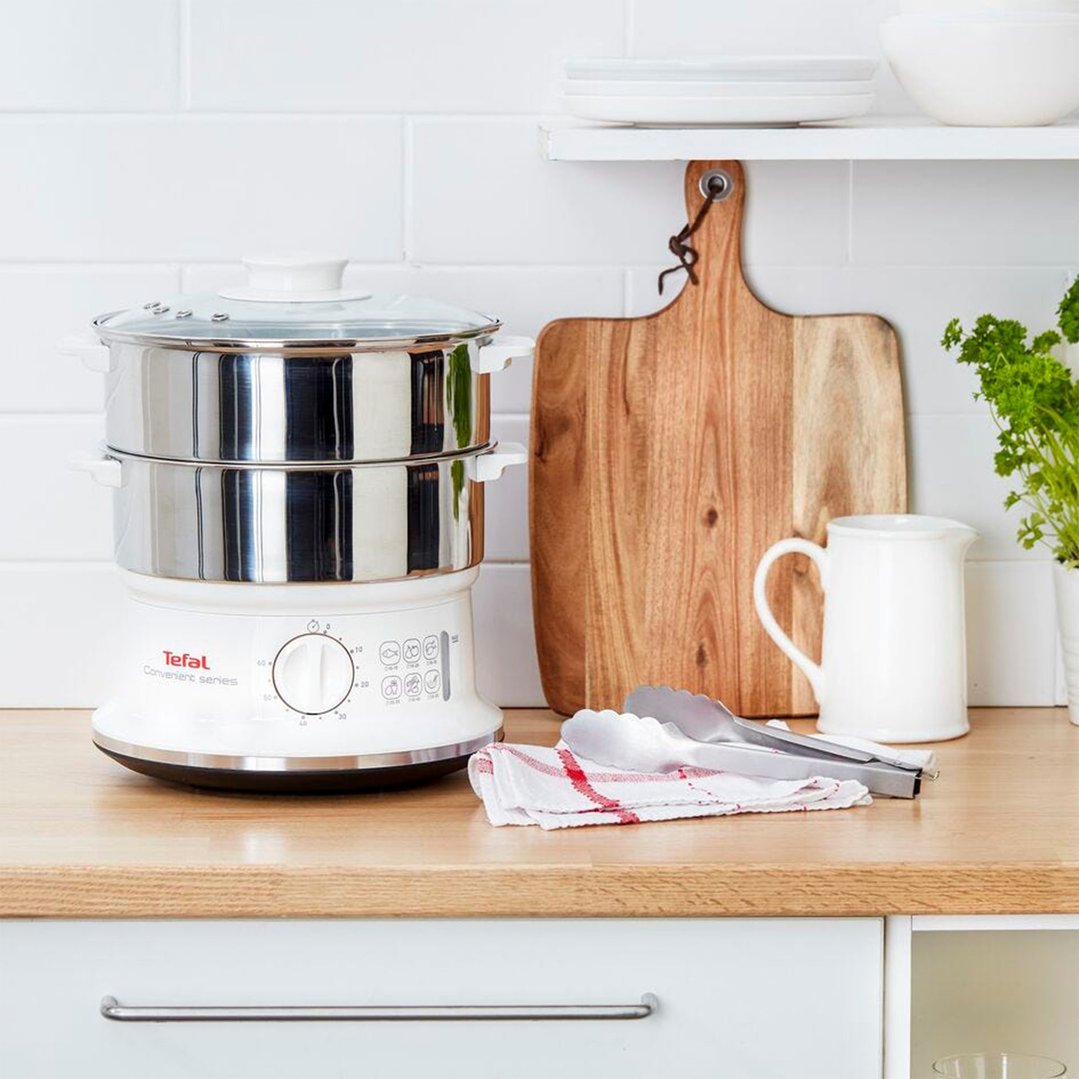 TEFAL Convenient Series Steam Cooker on a wooden kitchen bench with props