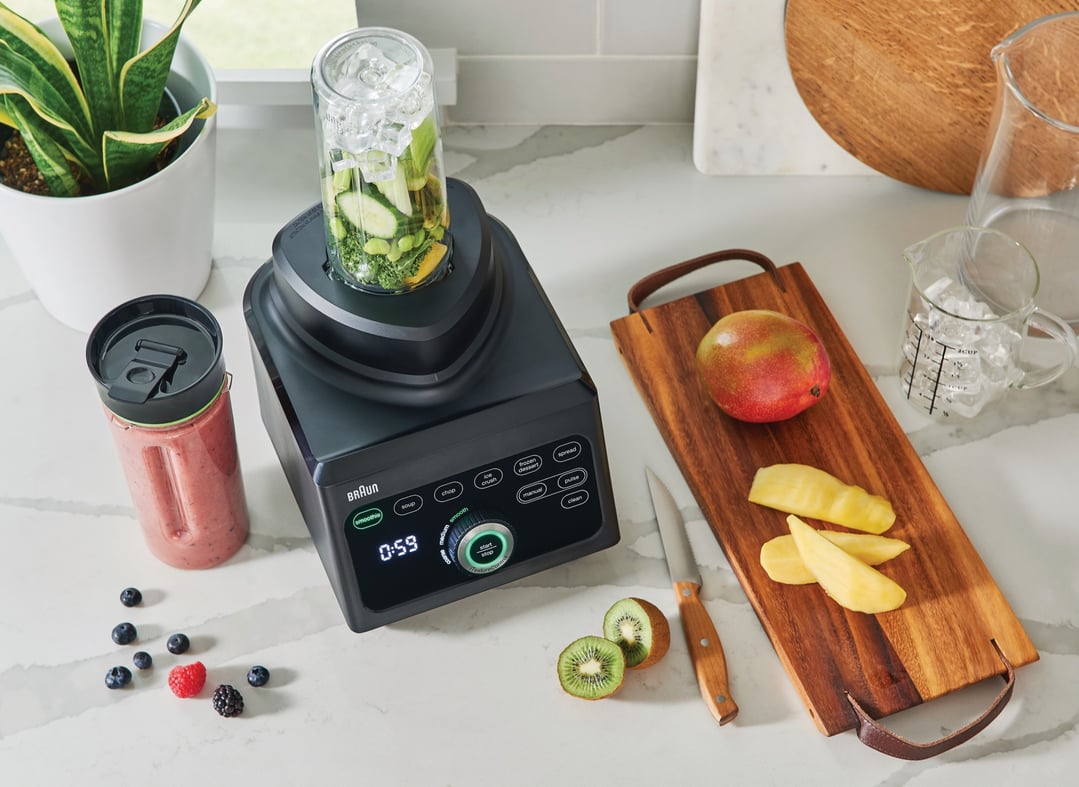 Braun PowerBlend 9 Jug Blender on a kitchen counter with fruits and ingredients