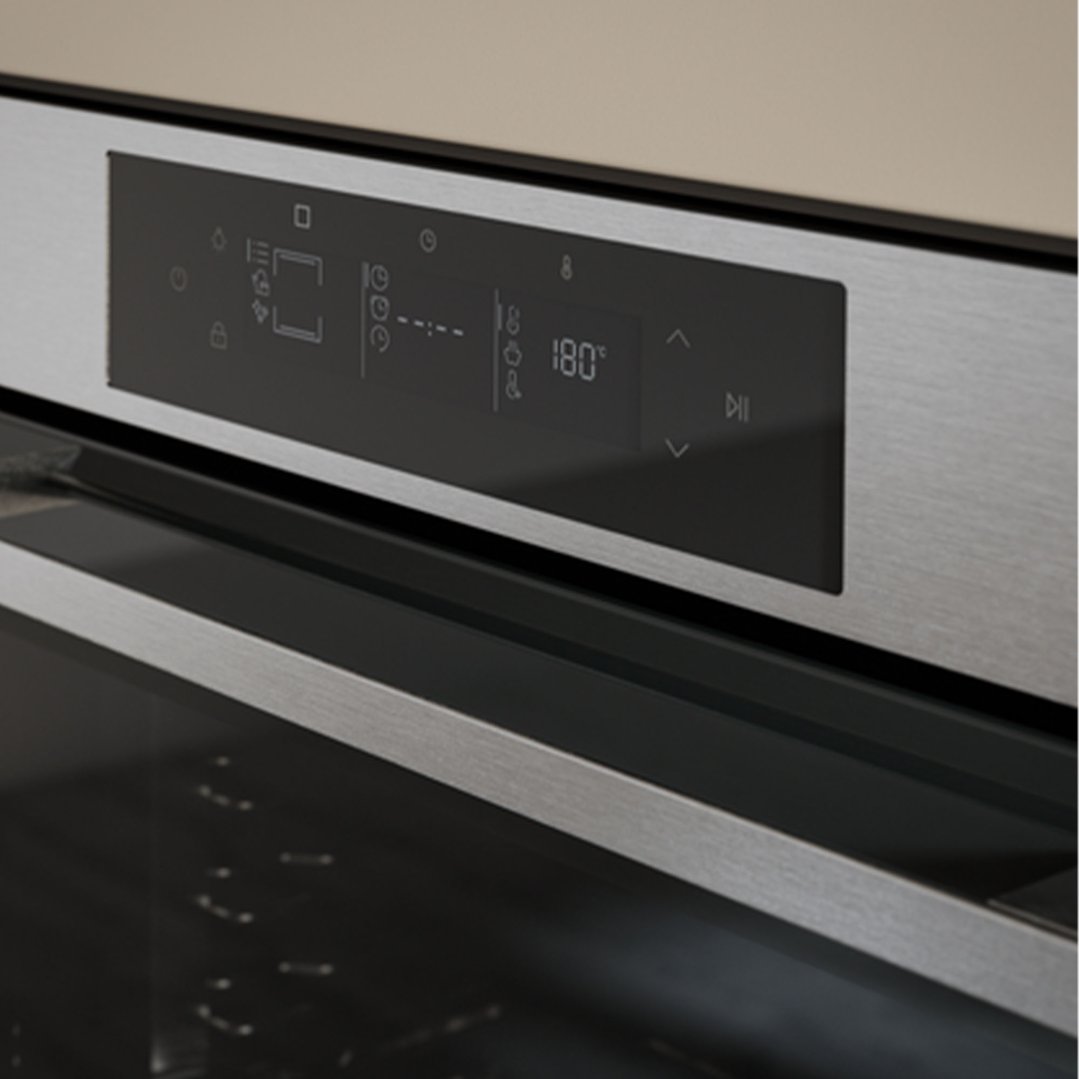 Close up of a built-in oven's control panel showing temperature setting