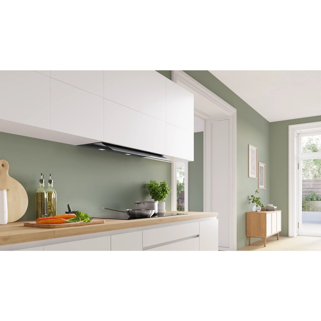 Integrated rangehood above an induction cooktop in a modern kitchen