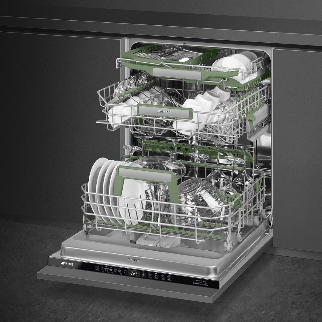 Open built-in dishwasher with dishes and glassware on racks in a kitchen setting