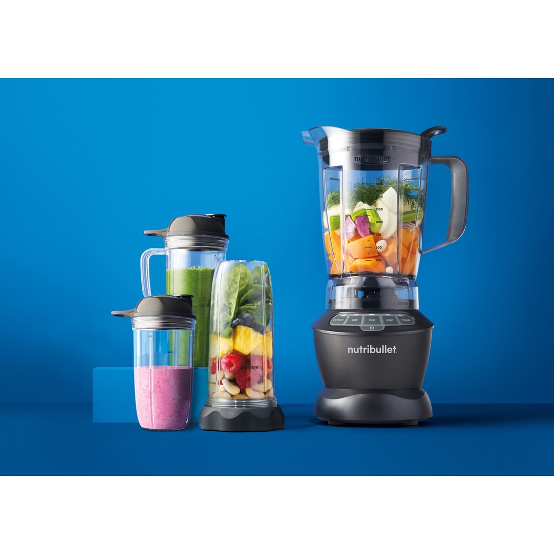 Nutribullet blender combo with two cups of smoothies on a blue background