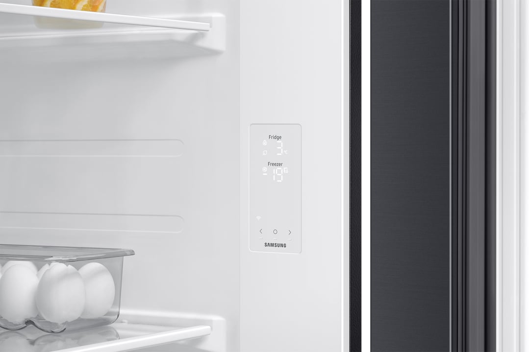 Inside a Samsung refrigerator showing the digital temperature display and egg tray