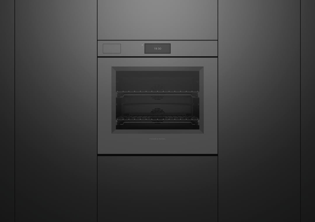 Built-in grey glass oven with a digital display showing 19:30