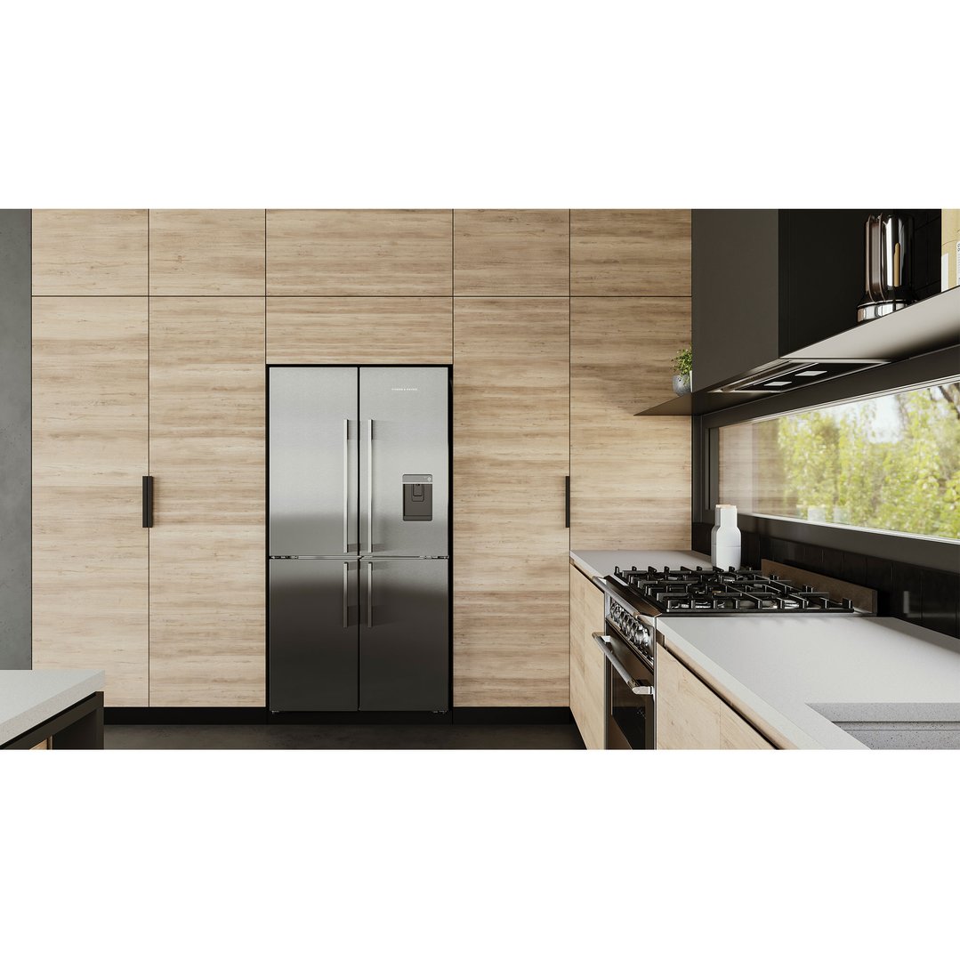 Stainless steel quad door refrigerator freezer in a modern kitchen with wooden cabinetry