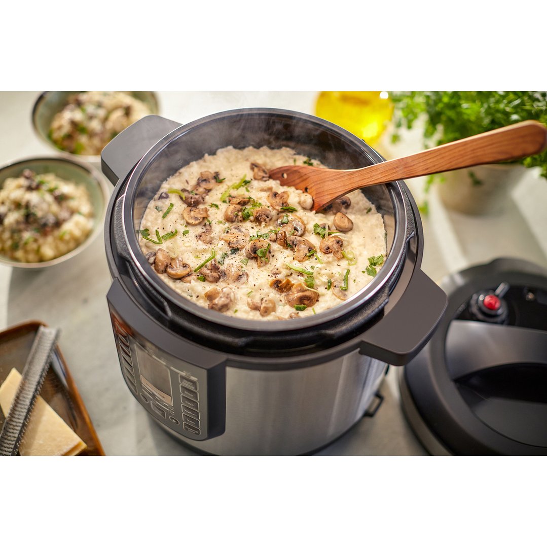 Mushroom risotto cooking in a Philips All-in-One Cooker on a kitchen counter