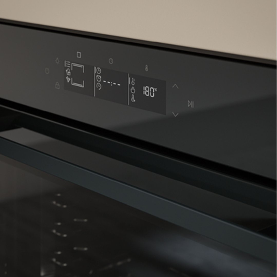 Close-up of a built-in oven's digital display showing temperature and settings