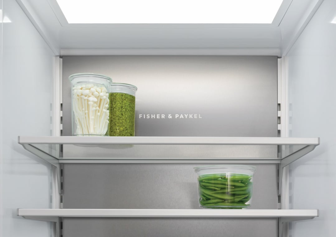 Interior view of a refrigerator with food items on the shelves
