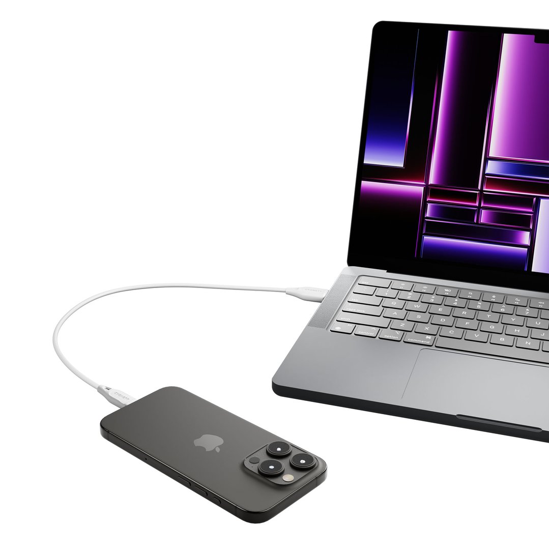 White USB-A to Lightning cable connecting a laptop and a smartphone
