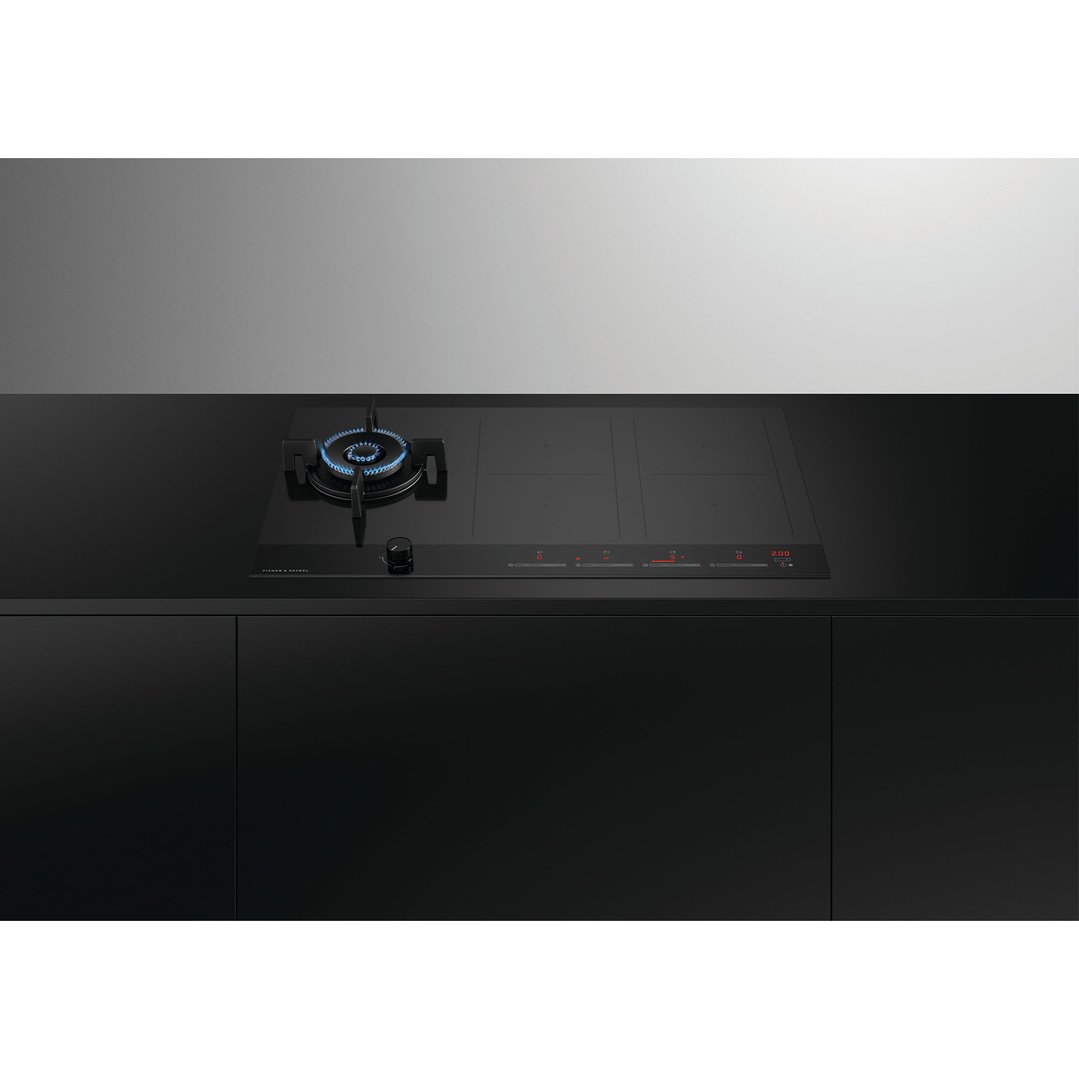 Hybrid cooktop with gas burner and induction zones in a modern kitchen