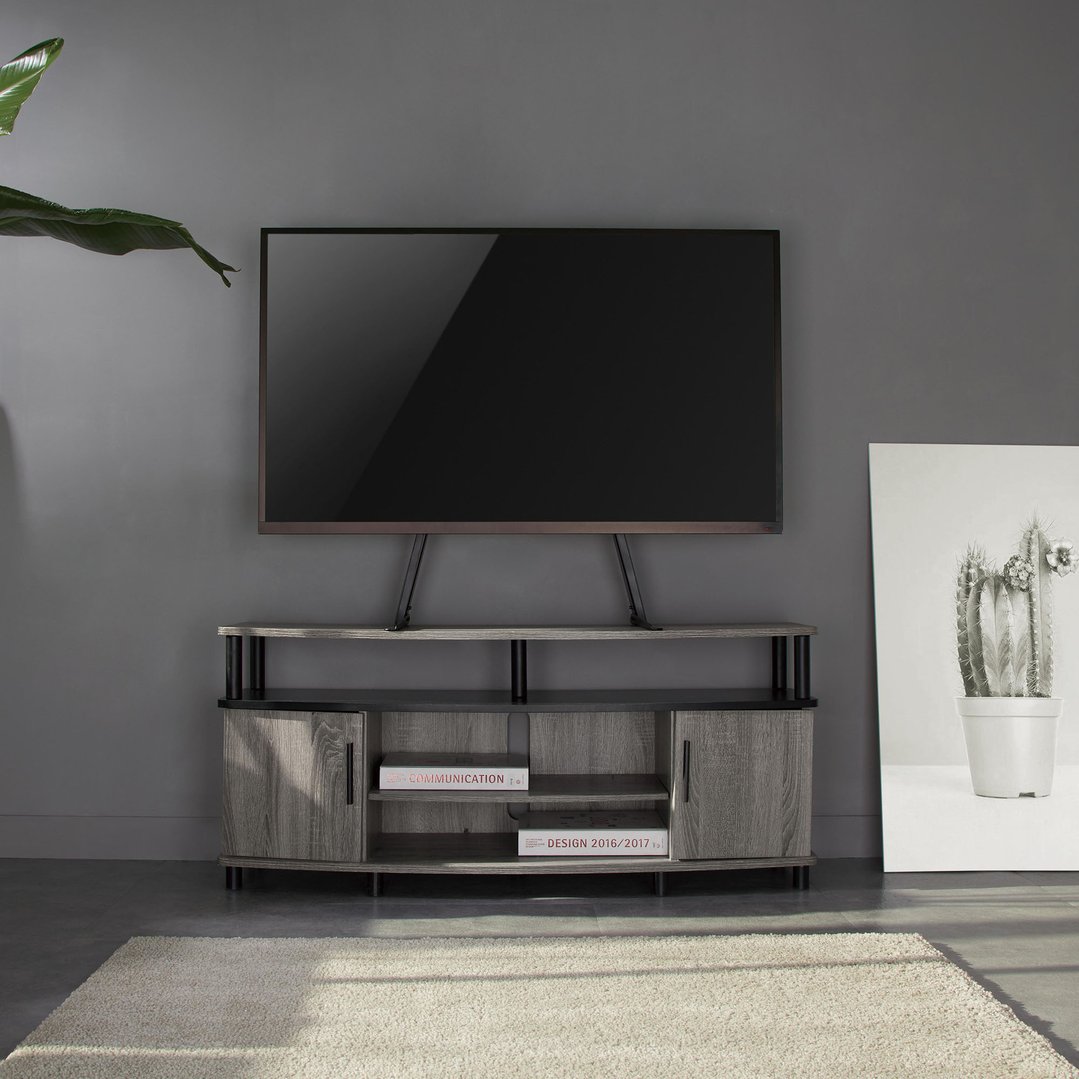 A TV stand with a TV on top, in a living room setting