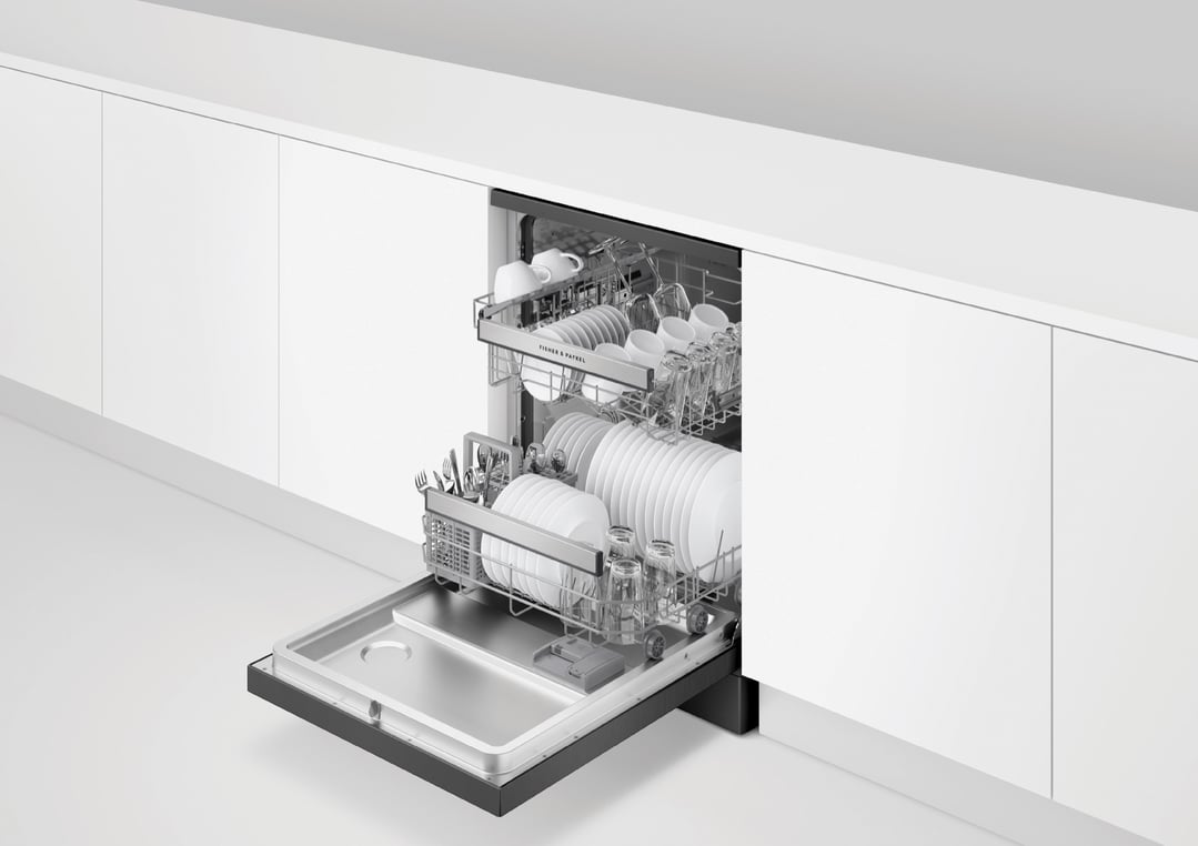 Open dishwasher with clean dishes and cutlery in a modern kitchen