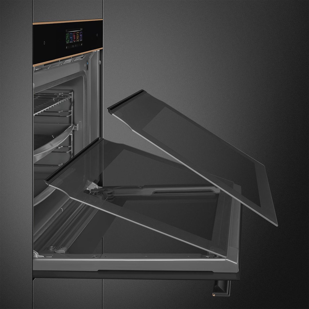 A Smeg Dolce Stil Novo oven with its door partially open, showing the interior