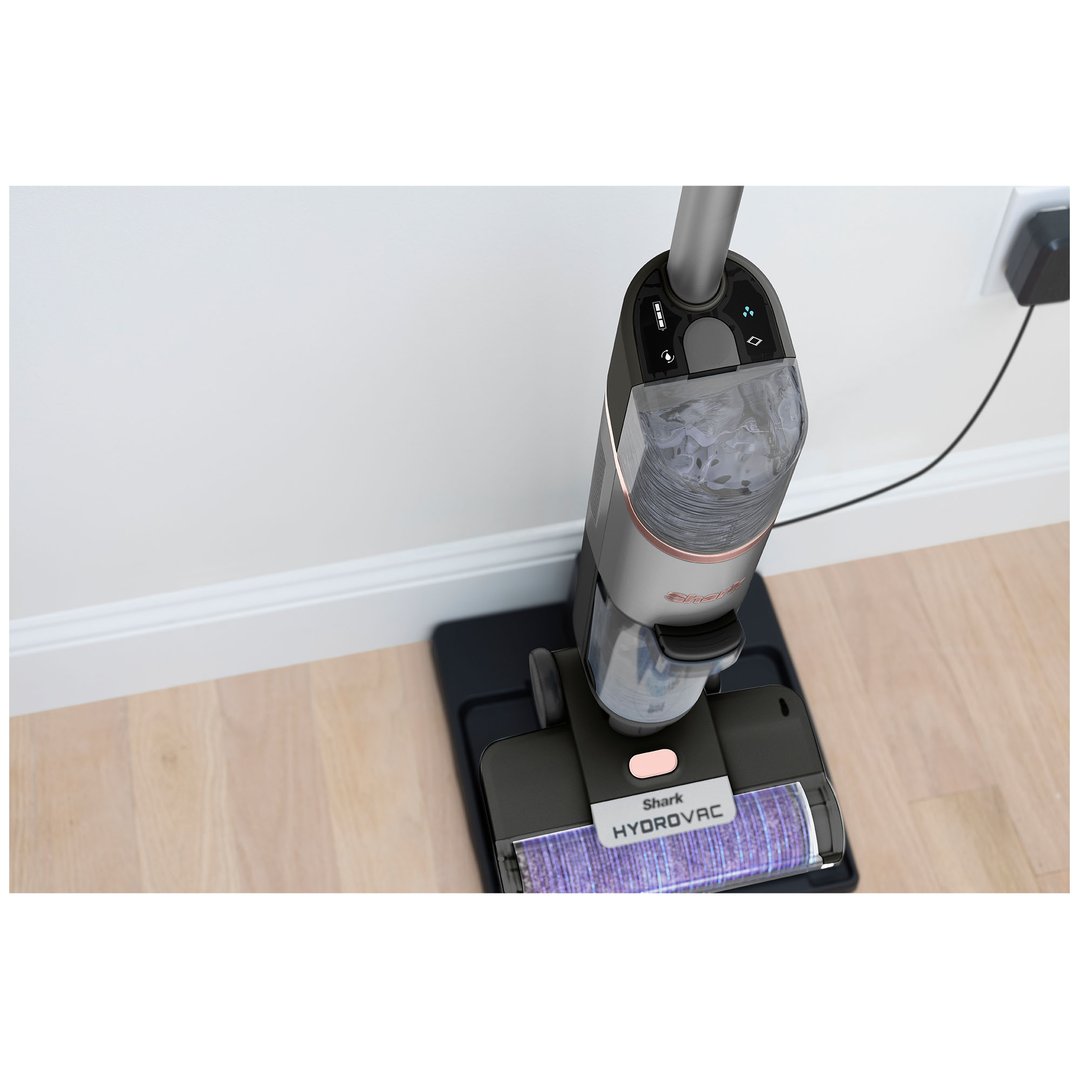 Shark HydroVac cordless 3-in-1 cleaner on a wooden floor next to a white wall